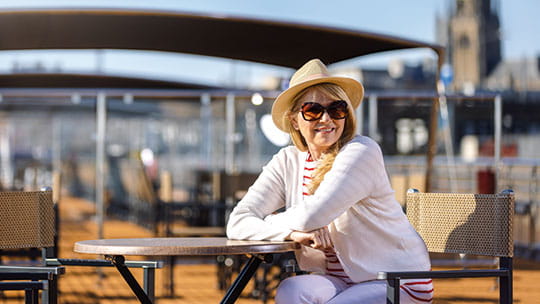 A woman sitting on the sun deck on Spirit of the Danube